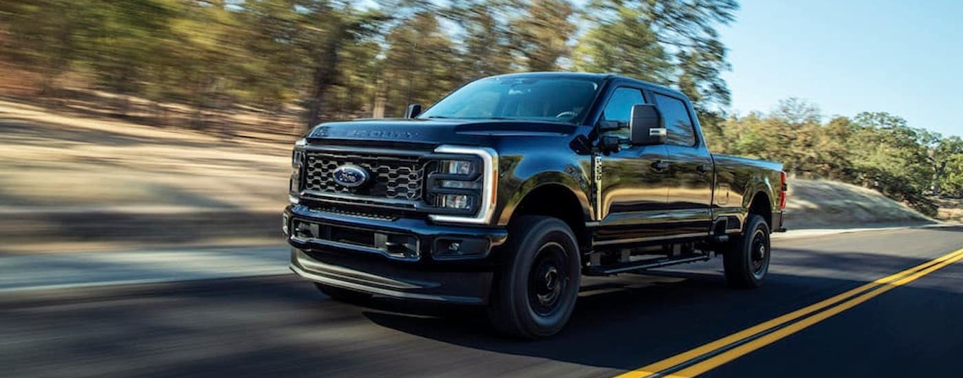A black 2023 Ford F-250 XL STX is shown from the front at an angle.