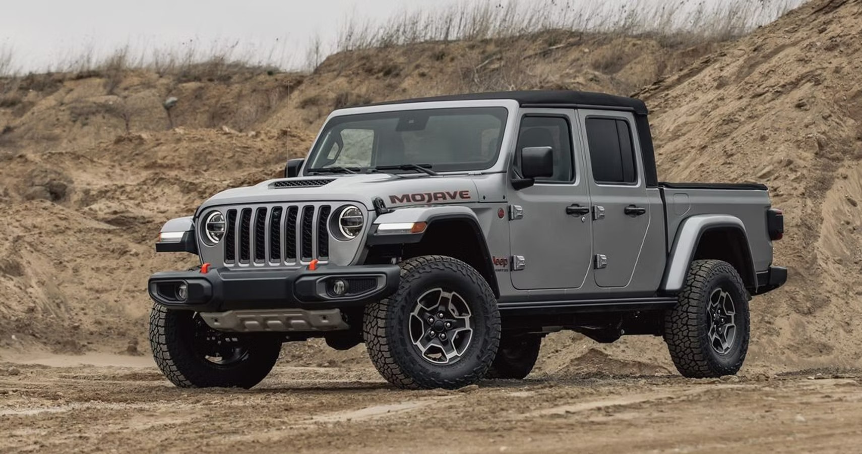 2020 Jeep Gladiator Mojave parked near sand dune