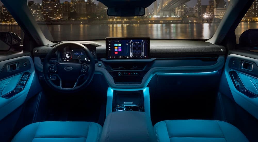 The black interior of a 2025 Ford Explorer Platinum is shown from above the center console.