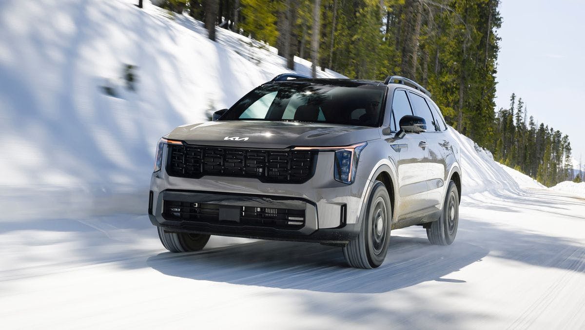 2024 Kia Sorento X-Pro in Wolf Gray driving on a snowy road