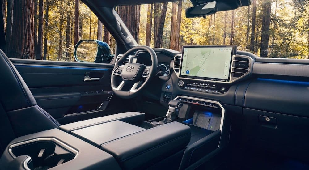 The black interior of a 2024 Toyota Sequoia is shown from the passenger side.