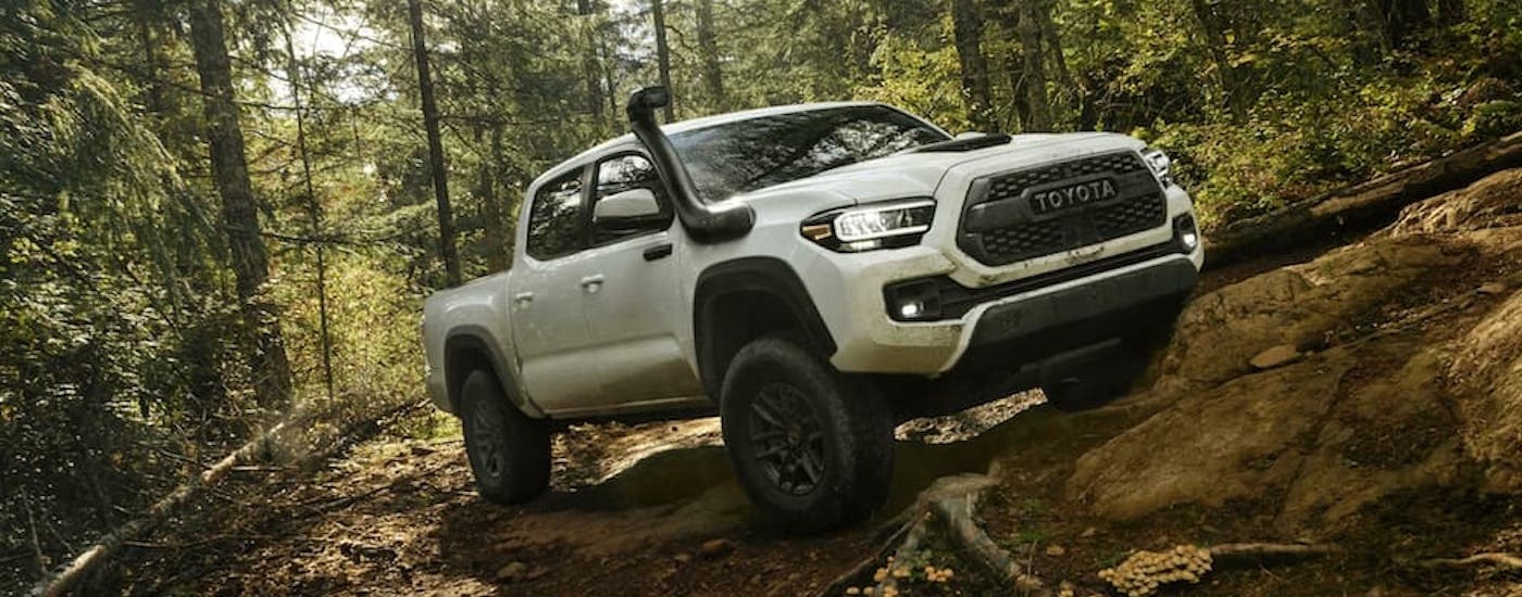 A white 2020 Toyota Tacoma TRD Pro is shown from the front at an angle after leaving a dealer that has used cars for sale near Keene.