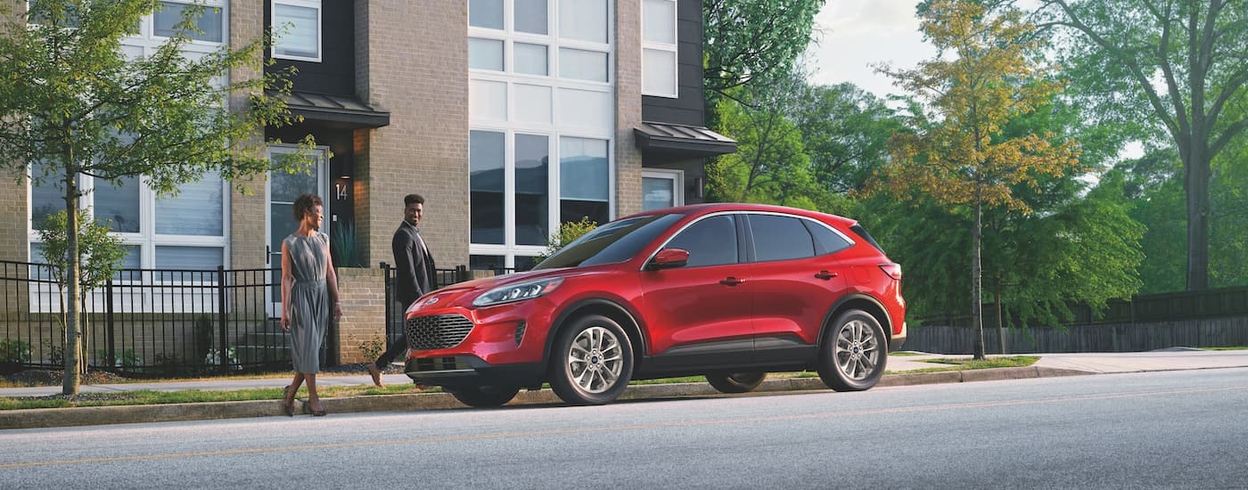 A red 2022 Ford Escape is shown from the side while parked.