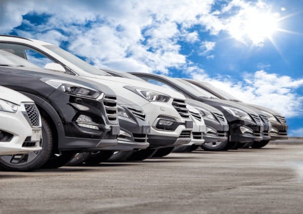 cars parked with blue sky