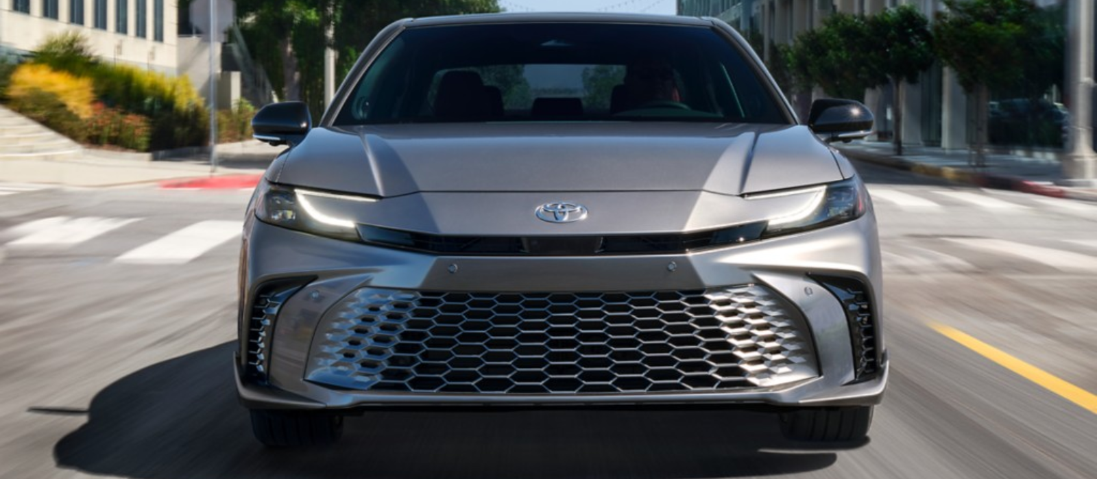 The 2025 Toyota Camry Hybrid introduces a new era of style, performance, and efficiency. With a sleek design and available two-tone color options, each trim level—LE, XLE, SE, and XSE—offers a unique driving experience. Powered by a hybrid drivetrain featuring a 2.5-liter four-cylinder engine and Toyota's fifth-generation Hybrid System, it delivers 225 horsepower in front-wheel-drive configuration and 232 horsepower with available all-wheel drive. Modernized interior features include digital instrument clusters, infotainment touchscreens, and wireless connectivity. Standard safety features such as Toyota Safety Sense 3.0 and available Premium Plus Package ensure a secure journey. With its blend of comfort, capability, and reliability, the 2025 Camry Hybrid redefines the sedan driving experience for the modern era.