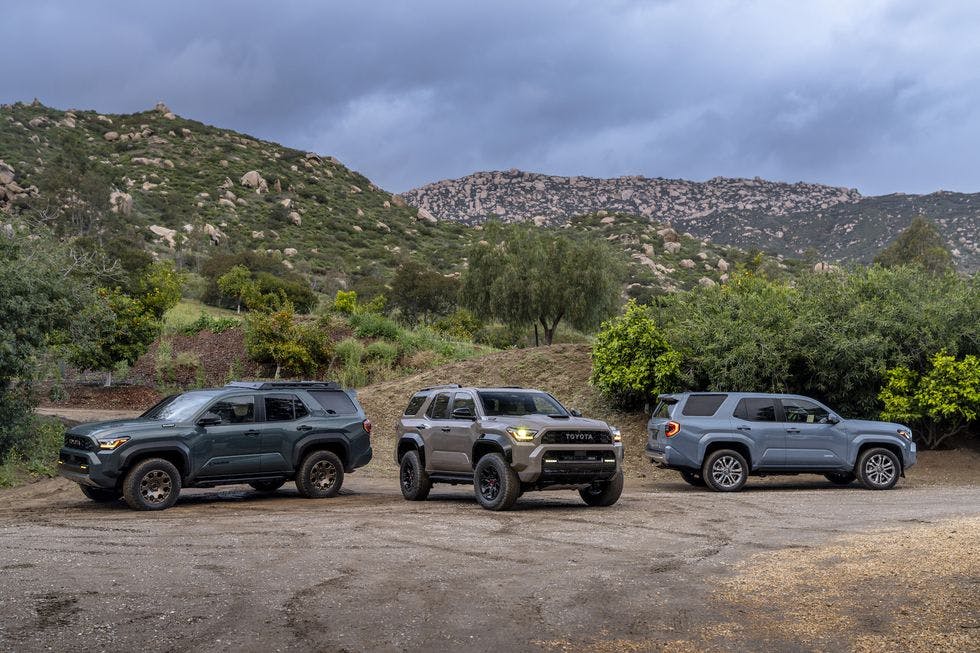 2025-toyota-4runner-group-jpg-66156248a78e8 2025 Toyota 4Runners on a dirt road in front of mountains