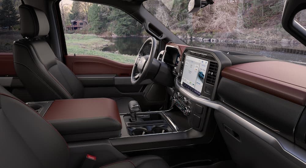 The brown interior of a 2022 Ford F-150 is shown from the passenger side.