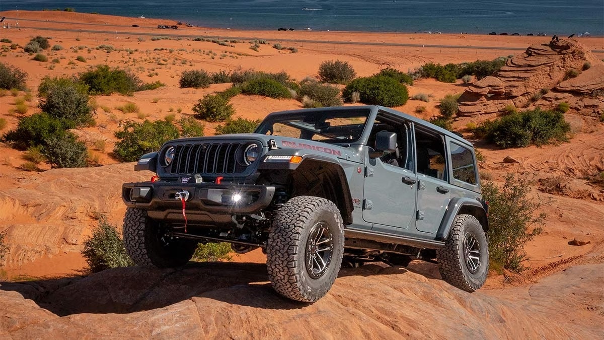 2024 Jeep Wrangler on a sandy hill by the water