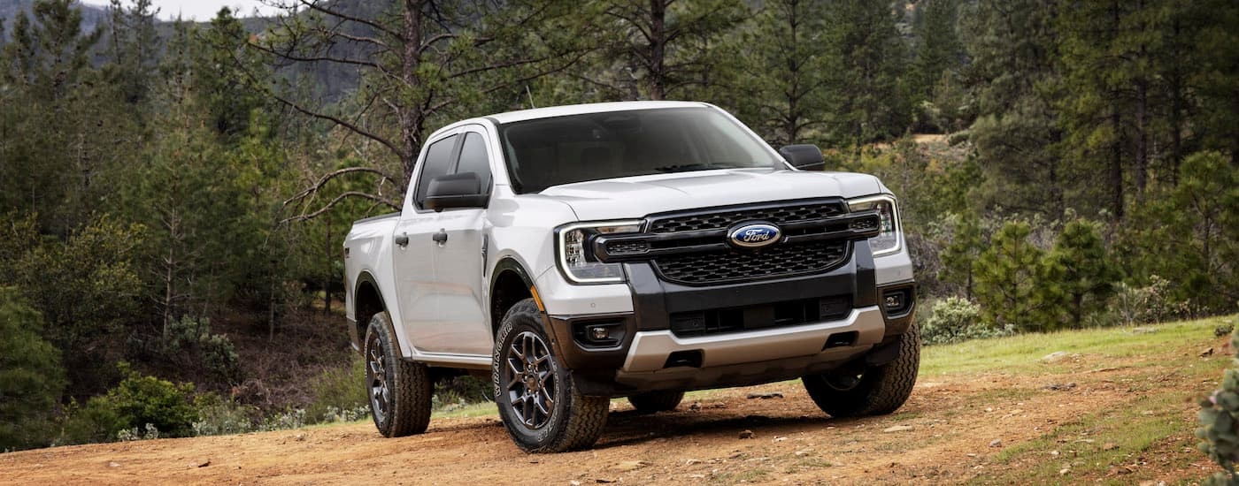 A white 2024 Ford Ranger XLT is shown from the front at an angle.