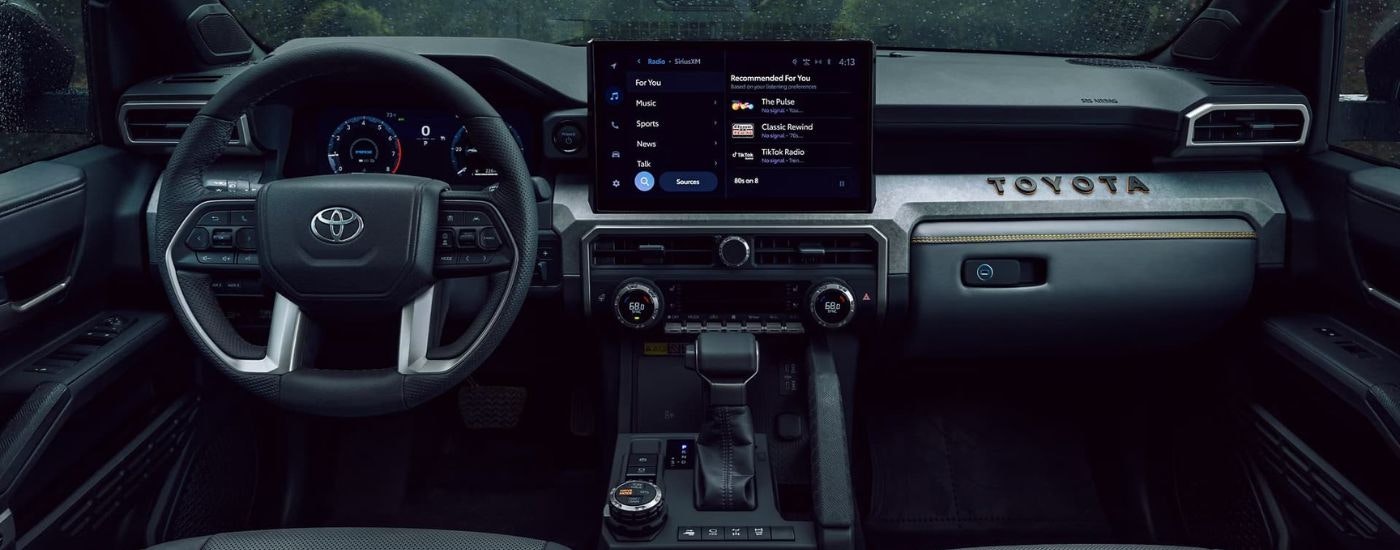 The black dash and infotainment screen in shown in a 2025 Toyota 4Runner.