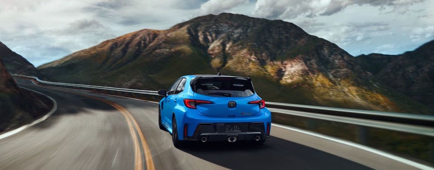 A blue 2024 Toyota GR Corolla is shown from the rear at an angle after leaving a Toyota dealer near Walpole.