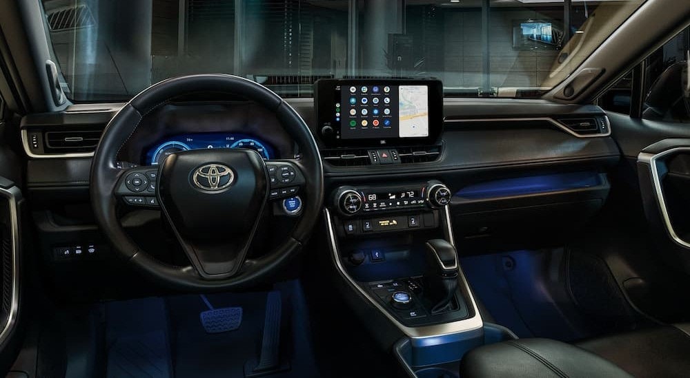 The black interior and dash in a 2024 Toyota RAV4 is shown.