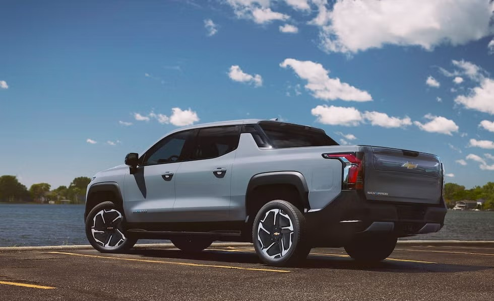 2025 Chevrolet Silverado parked in front of a lake