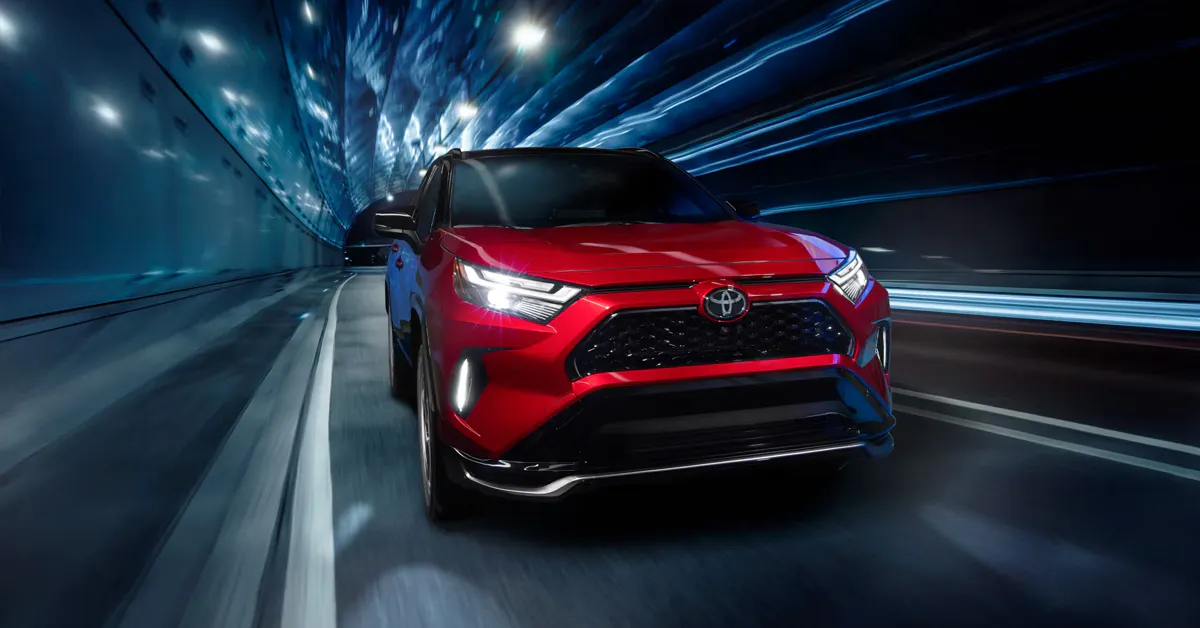2026 Toyota RAV4 Plug-in Hybrid driving through a tunnel at night.
