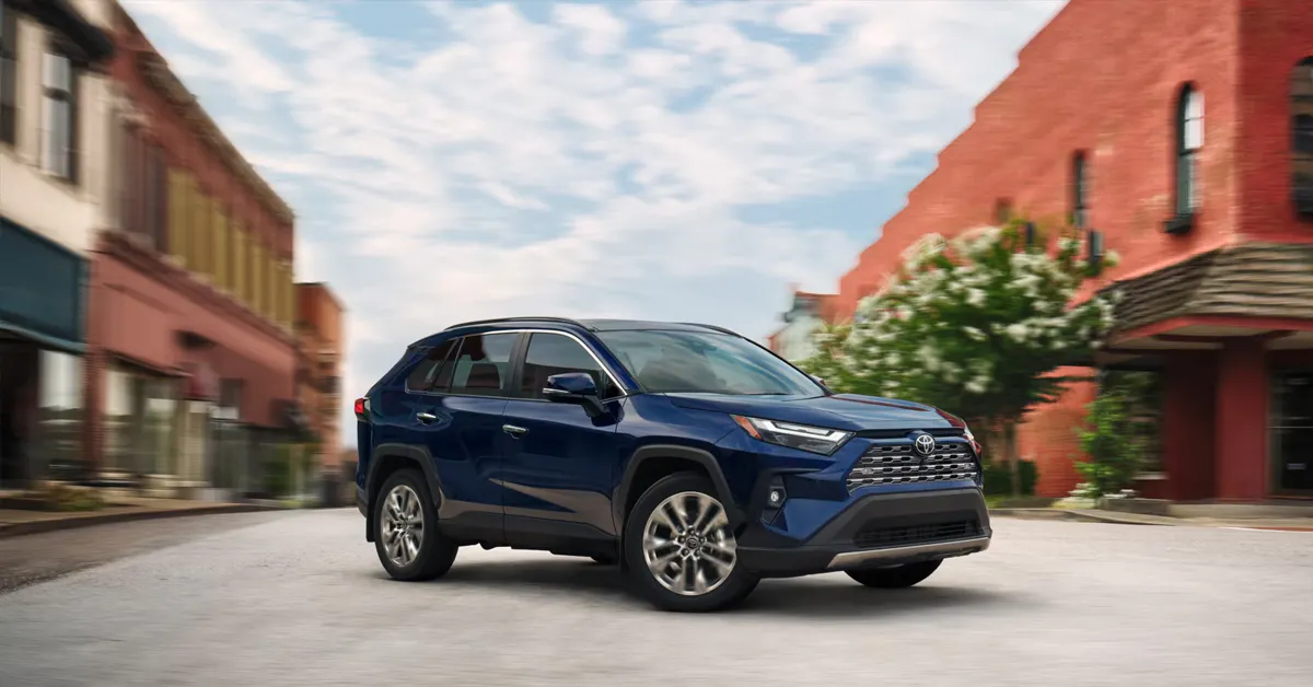 2026 Toyota RAV4 SUV driving through a city street