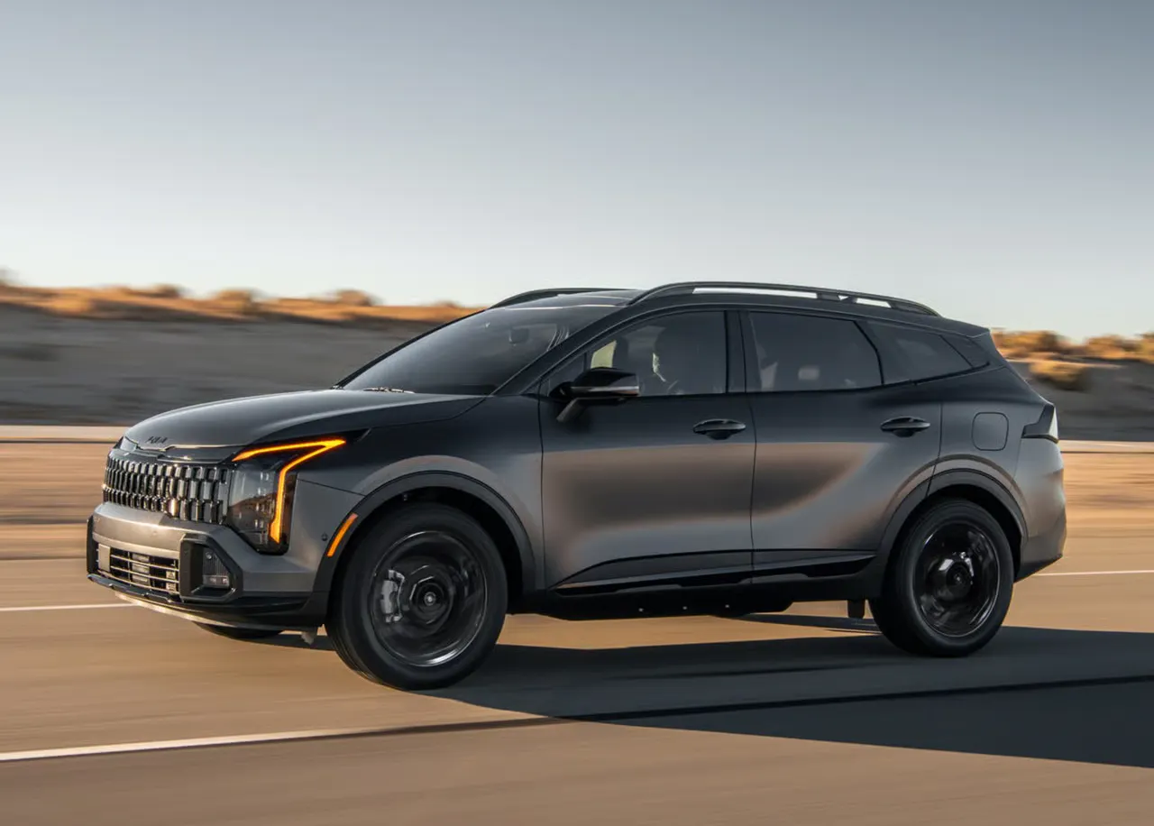 grey Kia SUV on a road