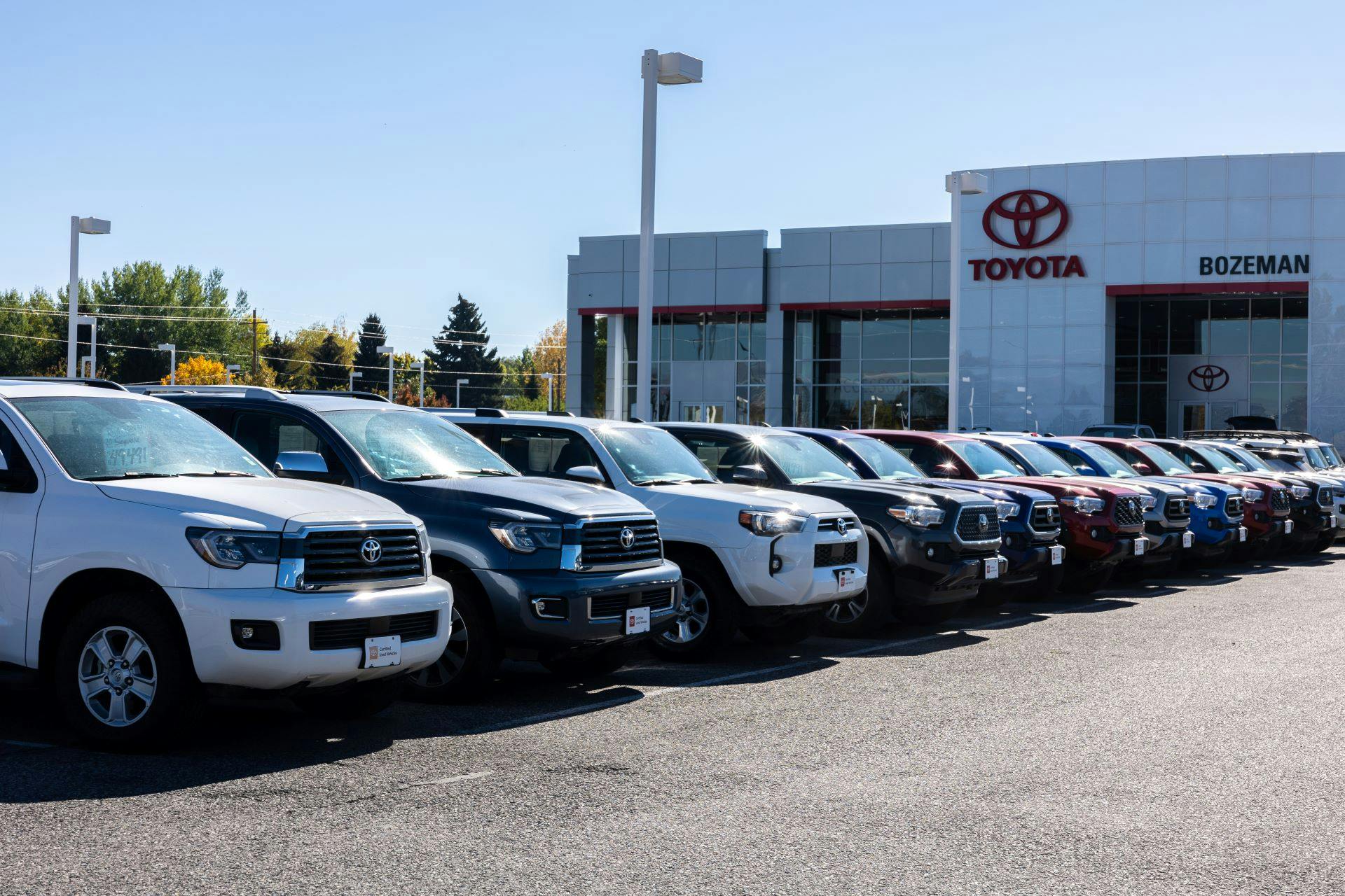 Assortment of Toyota Tacoma's and 4 Runners parked on Toyota of Bozeman lot near Helena Montana