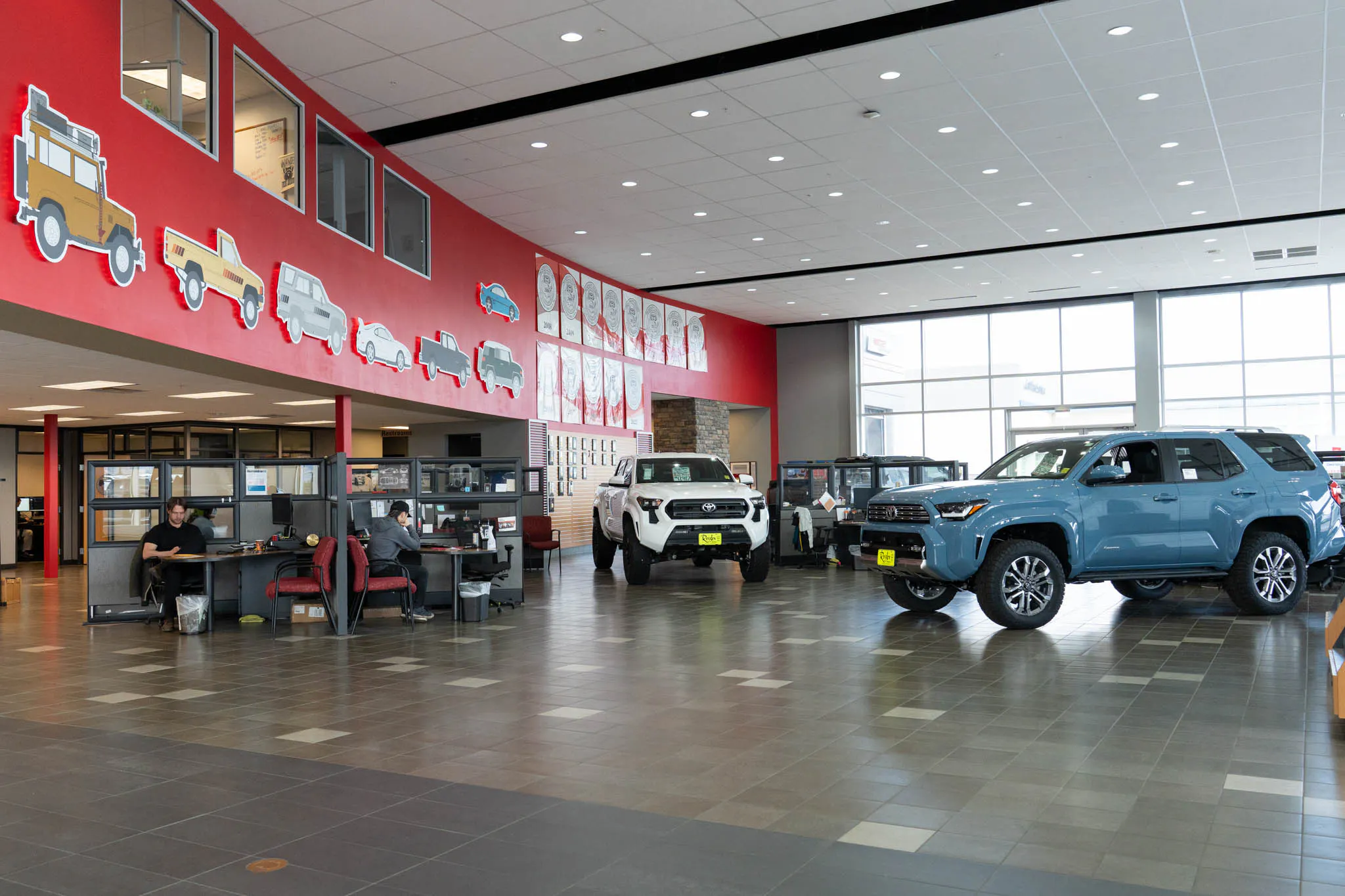 Toyota of Bozeman show room floor displaying multiple brand new Toyota SUV's and car's