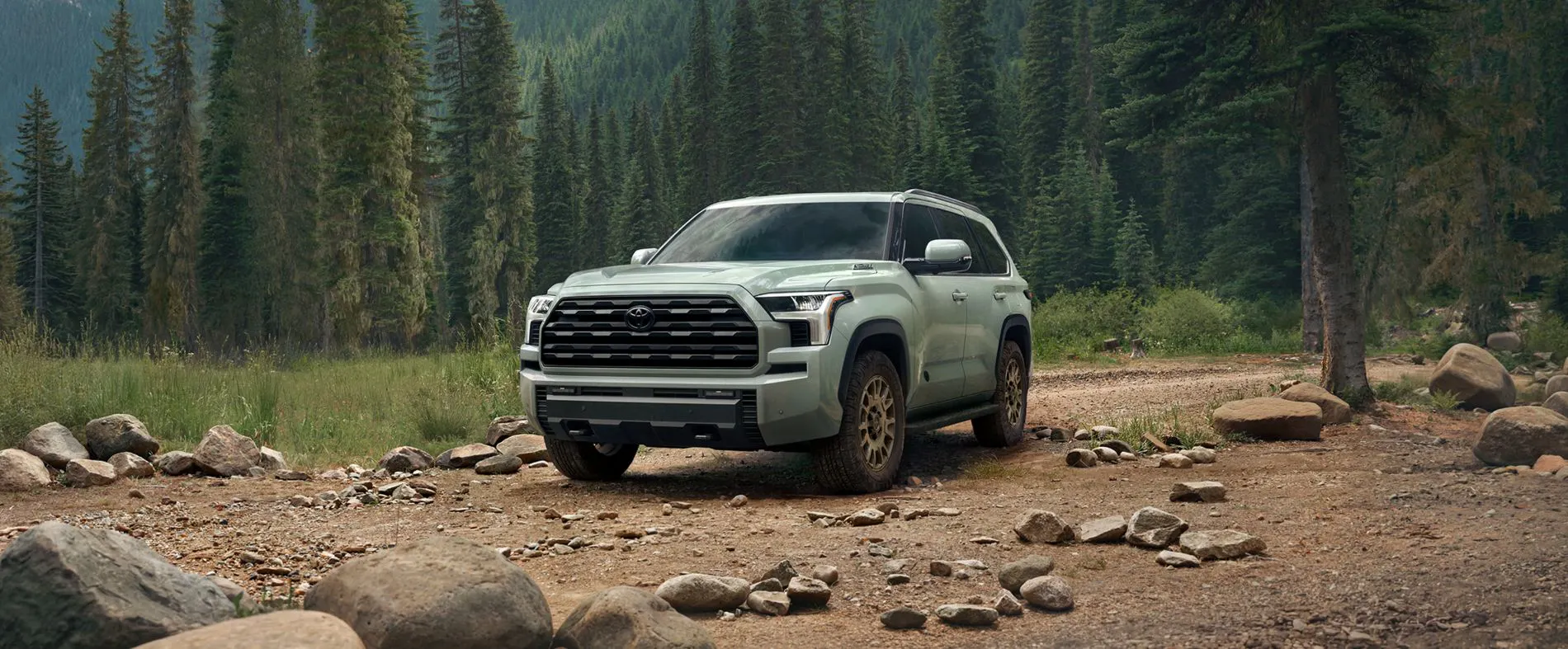 2027 Sequoia SUV parked in forest