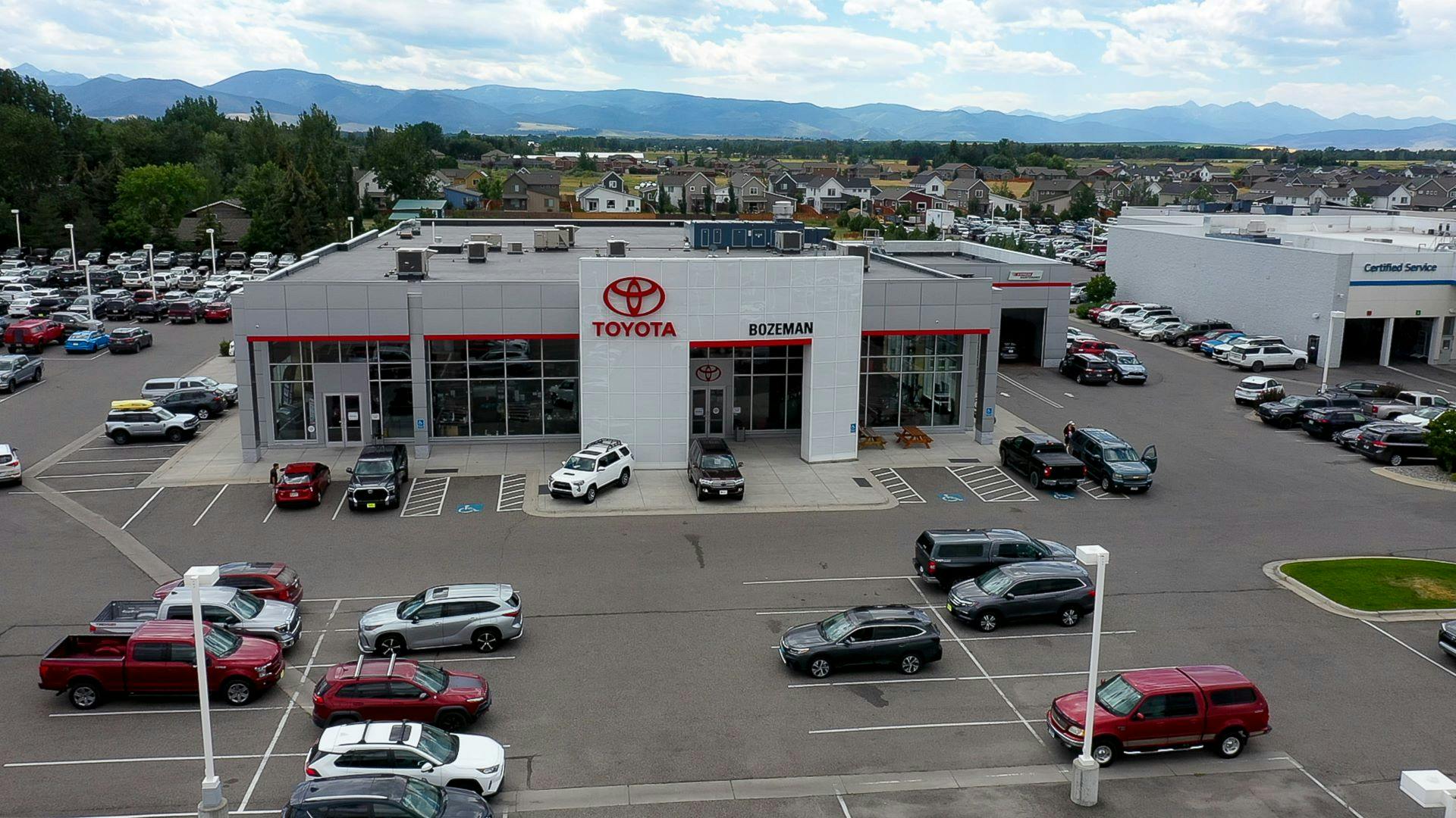 wide drone view of Toyota of Bozeman car lot near Livingston Montana