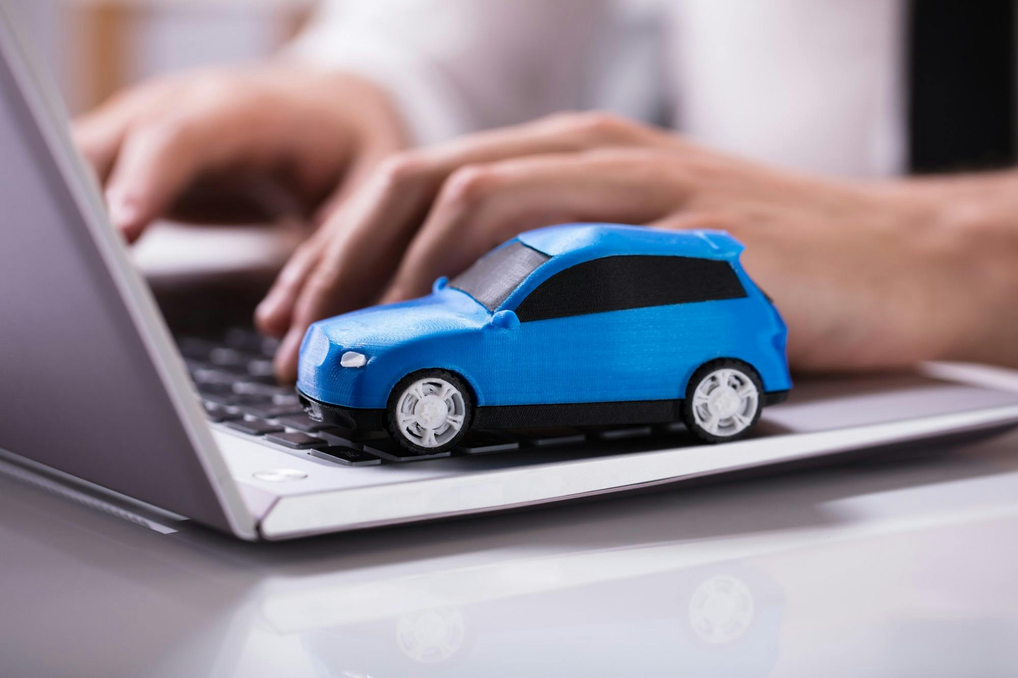 small car on laptop