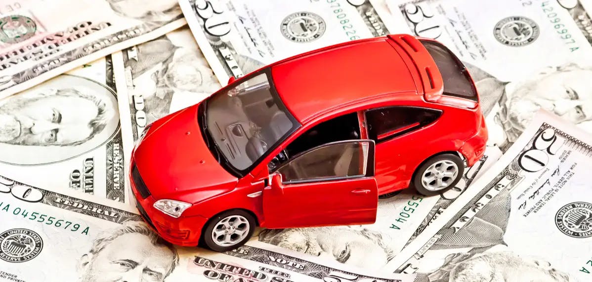 yf554xav toy car on money pile