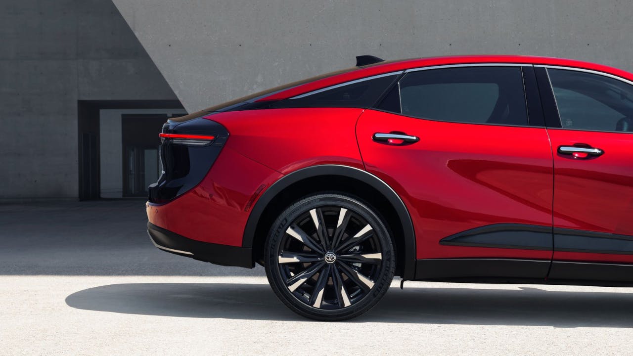 rear of a red and black Toyota Crown