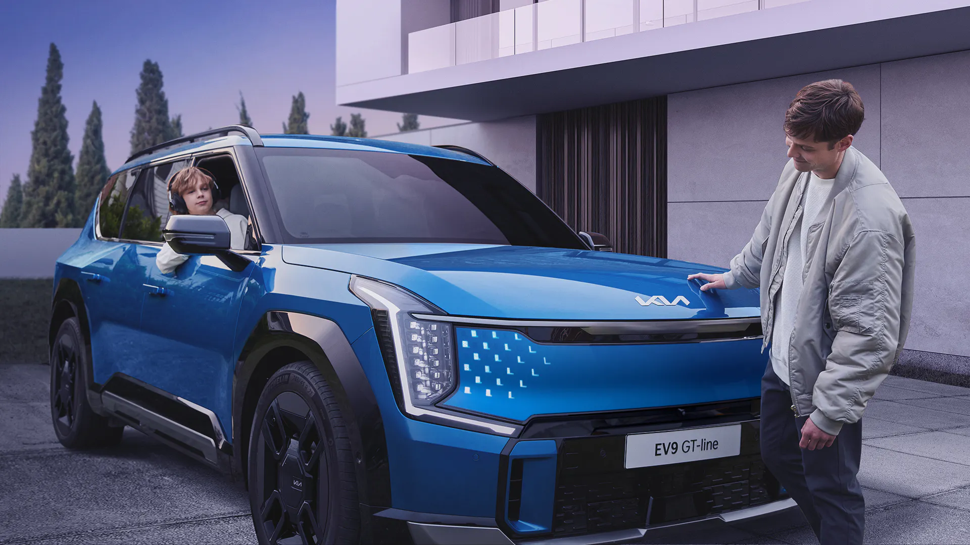 blue kia dad and son