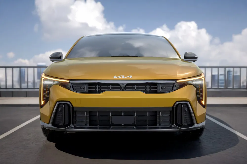 A head view of a yellow 2026 Kia K4.