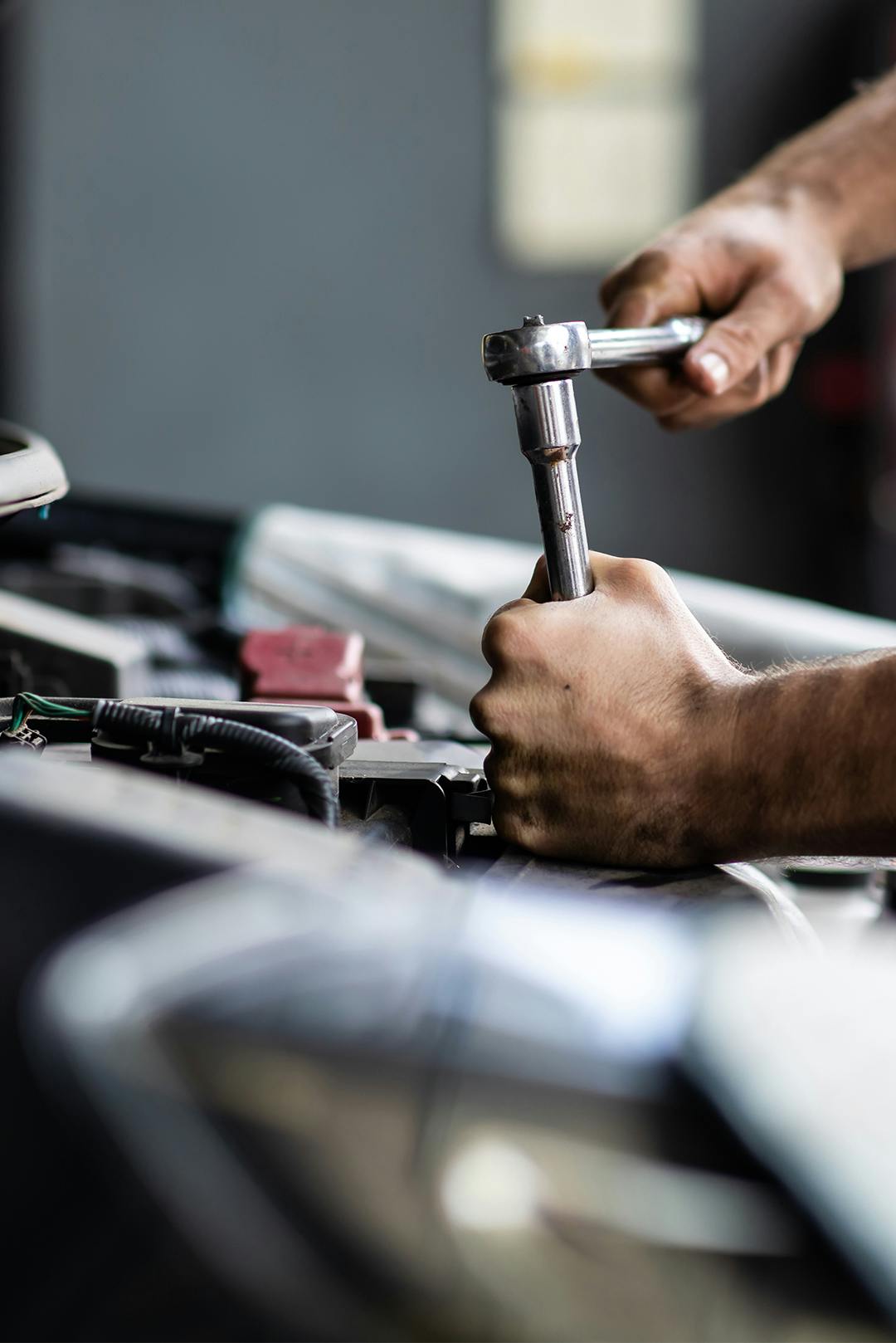 a close up of a service's tech tightening 