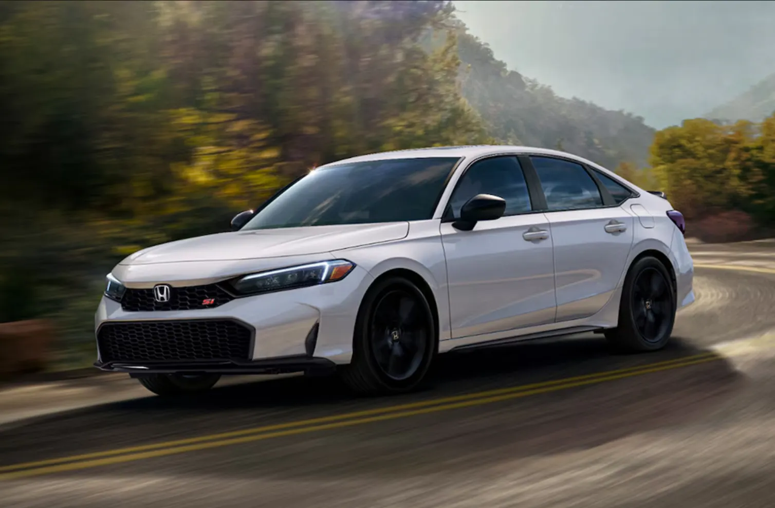 A white Honda Civic Si on a windy road.