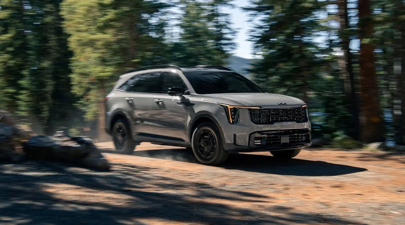 Kia Sorento driving on a dirt road