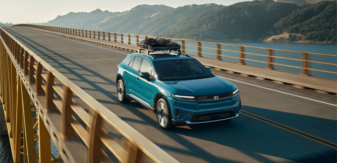 Honda Prologue driving down road