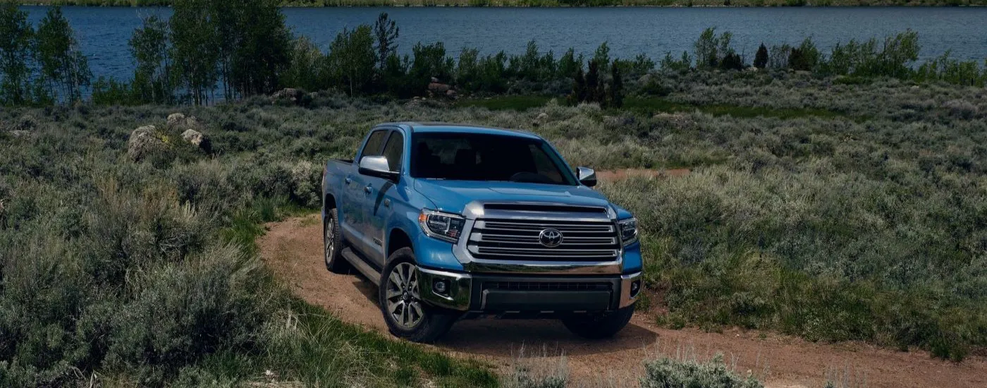 Blue 2020 Toyota Tundra driving off-road.