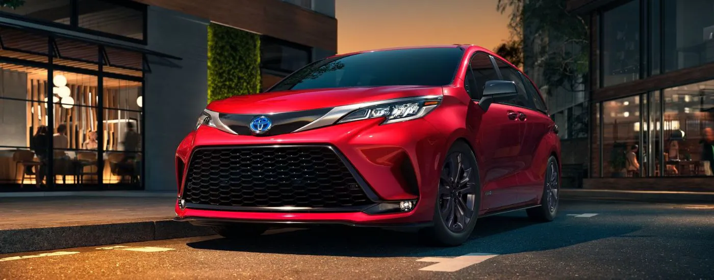 Red 2021 Toyota Sienna parked on a parking lot.