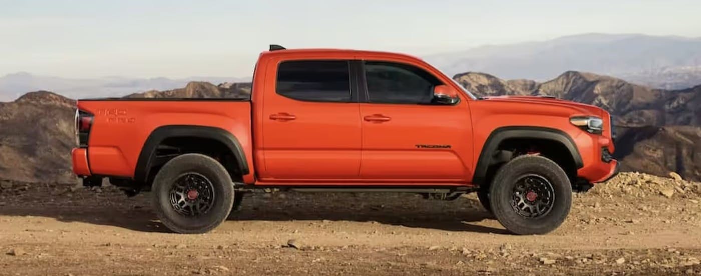 Orange 2023 Toyota Tacoma from the side