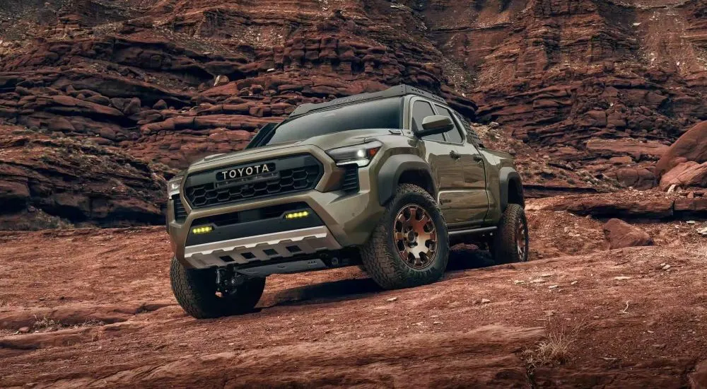 Green 2026 Toyota Tacoma Trailhunter parked off-road