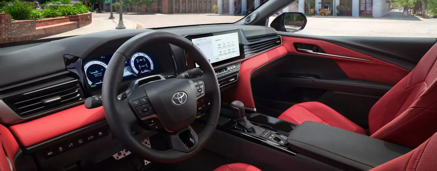 The black and red interior of a 2026 Toyota Camry.