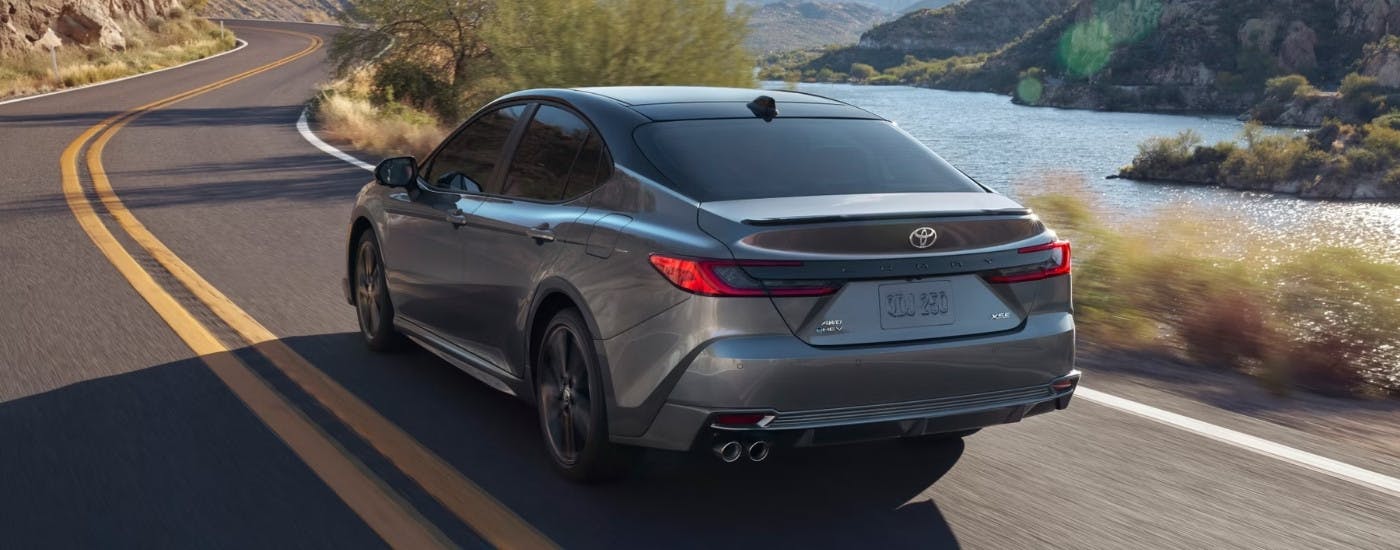 A grey 2026 Toyota Camry from the rear at an angle.