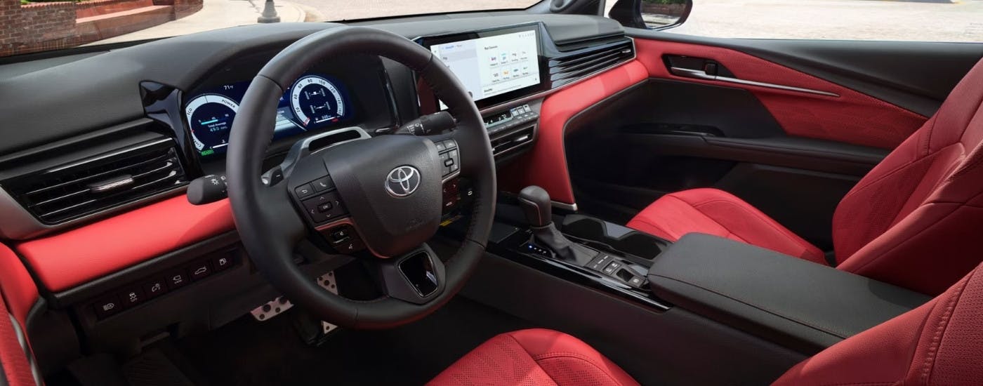 The red interior of a 2026 Toyota Camry.