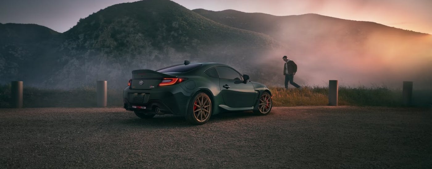 A green 2025 Toyota GR86 Hakone Edition from the rear.