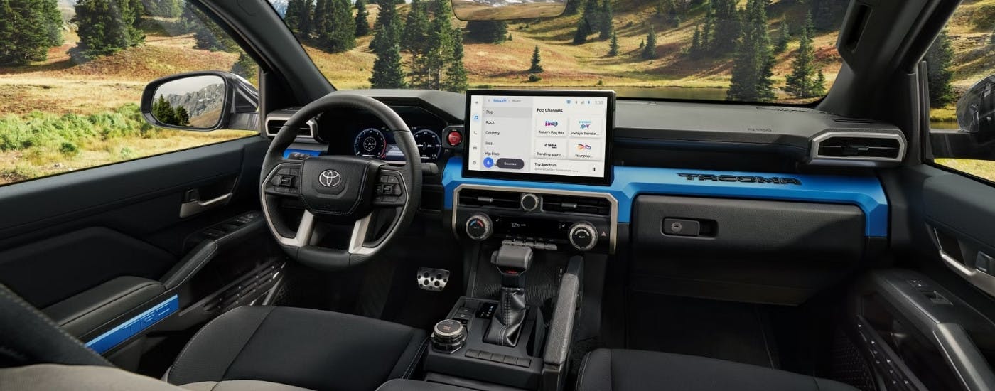 The black interior of a 2025 Toyota Tacoma.