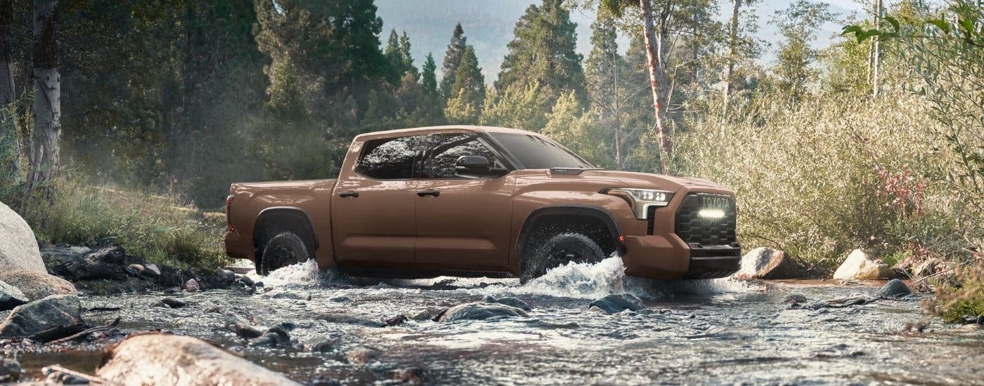 A brown 2025 Toyota Tundra from the side.