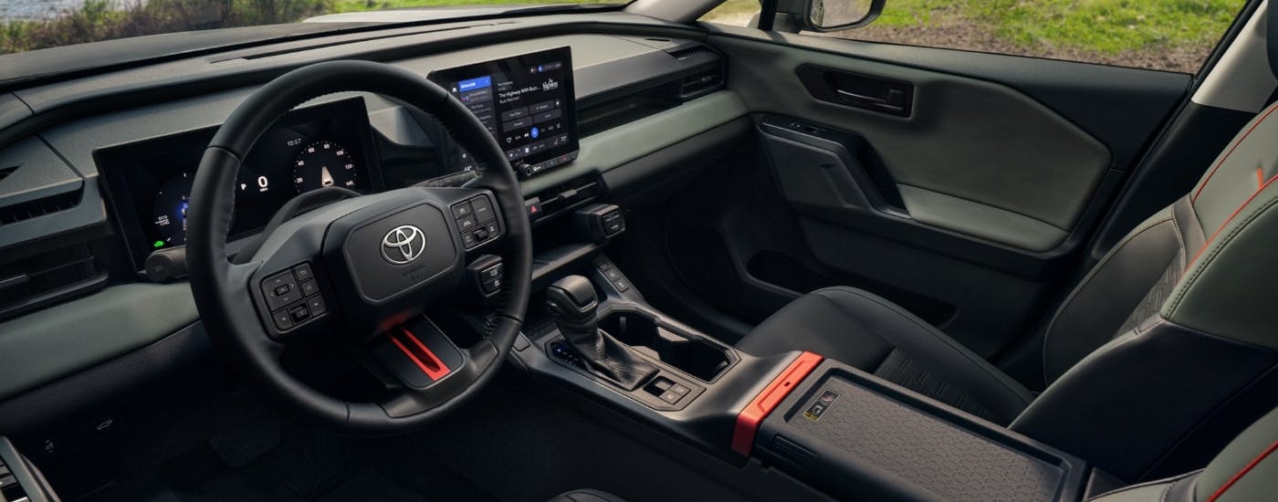 The black interior of a 2026 Toyota RAV4 for sale.