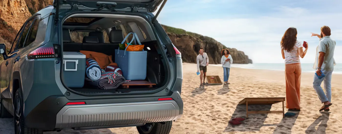 Blue 2026 Toyota RAV4 parked on a beach