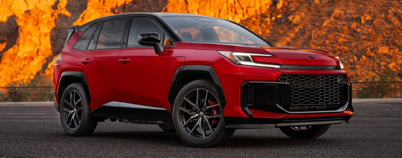 Red 2026 Toyota RAV4 Hybrid parked at an angle