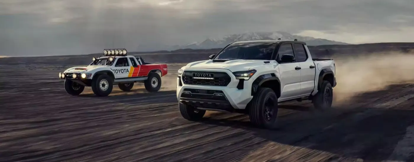 White 2026 Toyota Tacoma TRD Pro driving off-road.
