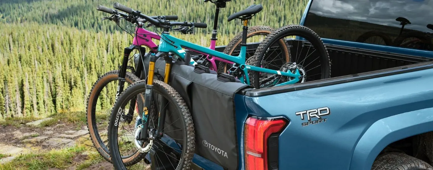 Bike in the bed of a blue 2026 Toyota Tacoma TRD Sport 