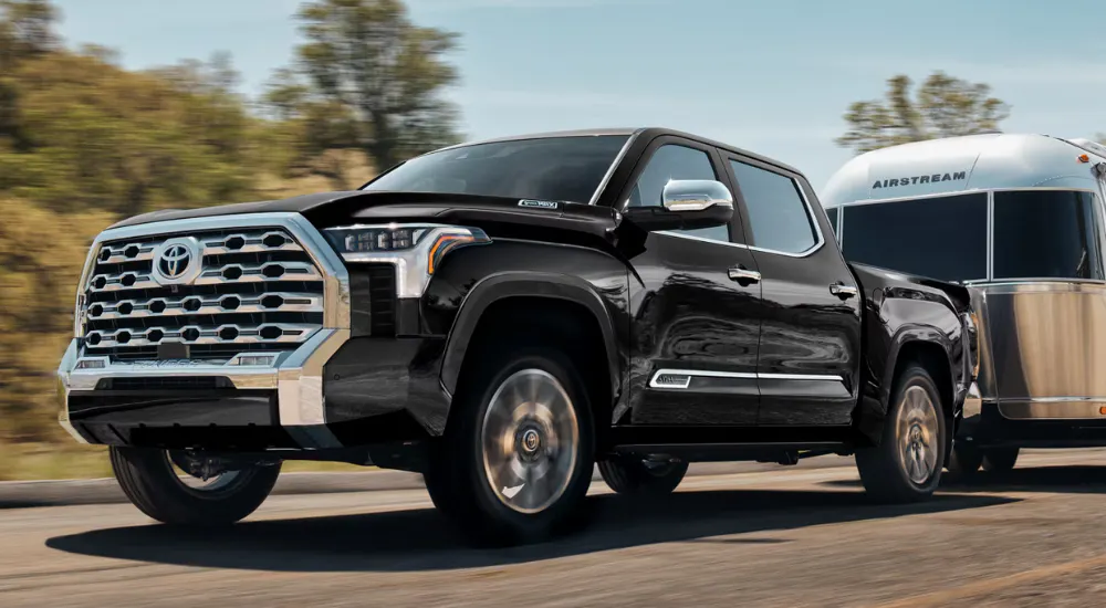 Black 2026 Toyota Tundra 1794 towing an Airstram