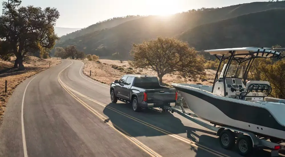 Grey 2026 Toyota Tundra Limited towing a boat